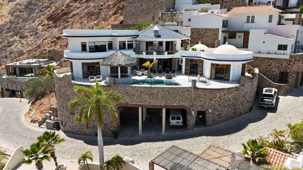 Los Cabos Pedregal Csl Commandingly positioned in the exclusive enclave of Pedregal, Casa El Castillo offers rare walkable proximity to downtown alongside total hillside privacy. This 6-bedroom, 7.5-bathroom architectural estate--originally built by fitness icon Ray Wilson--was masterfully oriented to maximize its vantage point. The result is a breathtaking, unobstructed panorama spanning the Cabo San Lucas Marina, vibrant city lights, and dramatic – 175 Camino Grande, Cabo San Lucas, BS