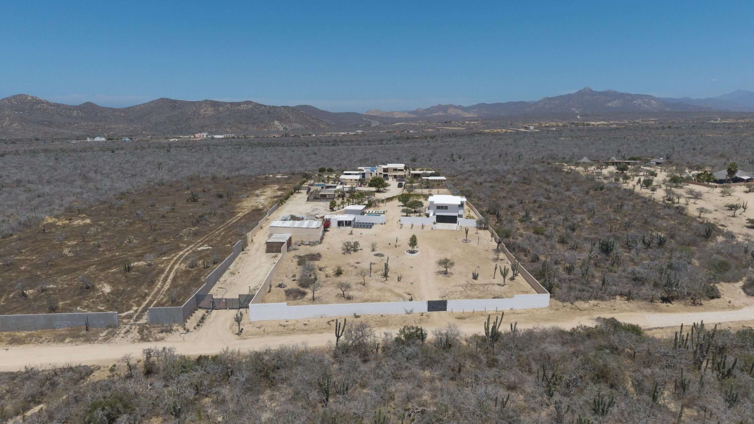 Los Cabos El Tule-Inland:General Rare investor opportunity in the San José Corridor. 2 luxury residences fully completed and move-in ready. 8 additional units with land secured and full blueprints in place -- ready to build to buyer's vision. At – 2-C Cerro del Vigia, Cabo San Lucas, BS